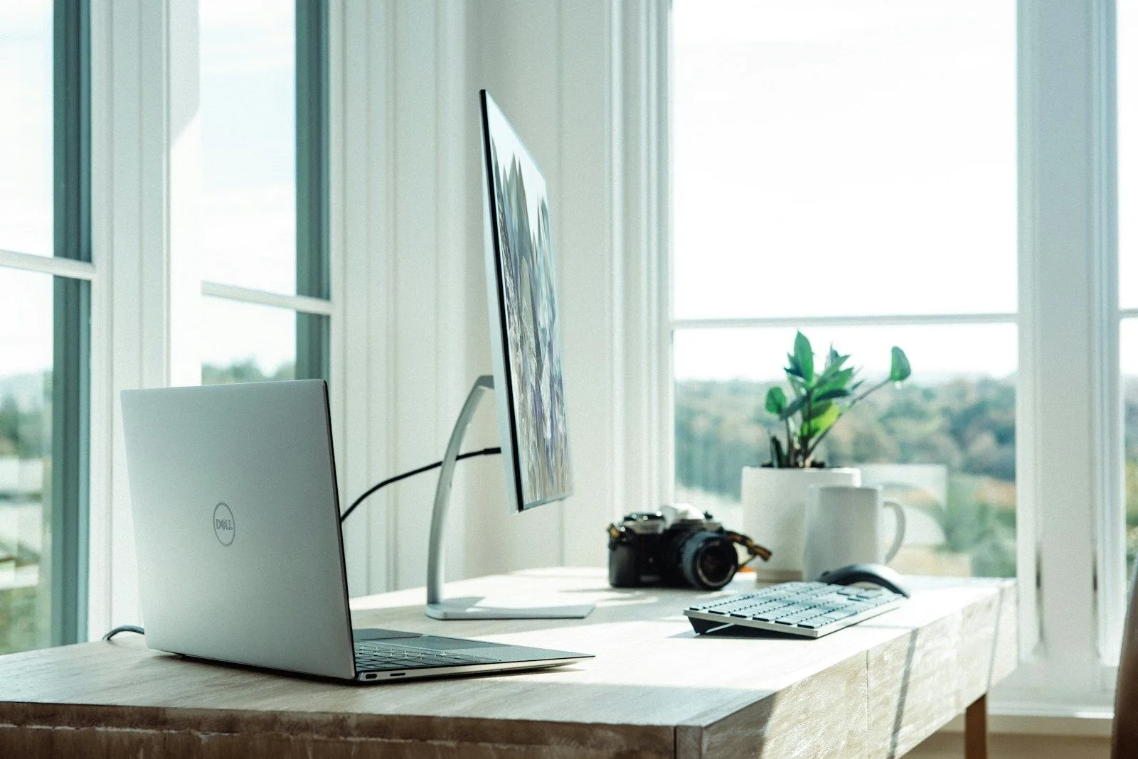 Minimalist dark mode desk setup with warm amber lighting